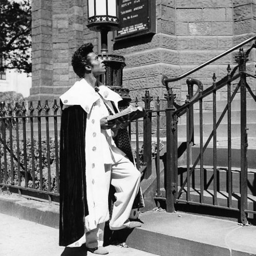 Little Richard praying outside of a church