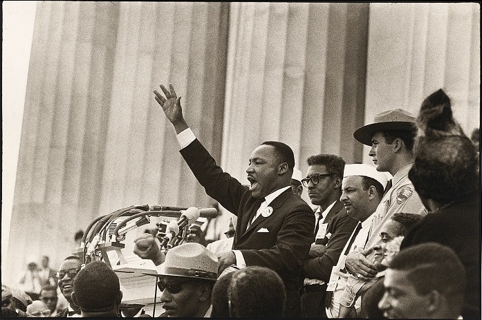 MLK delivering a speech in front of the Lincoln Memorial.